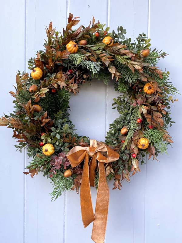 
                  
                    orange autumn wreath with pumpkins
                  
                