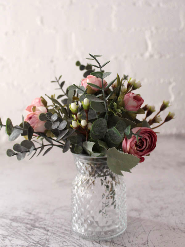 
                  
                    small artificial flower arrangement
                  
                