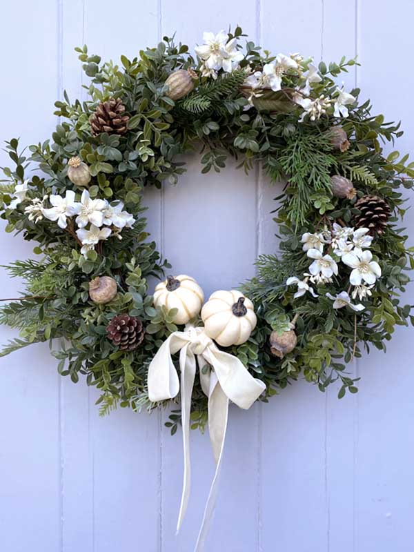 dried poppy heads on wreath